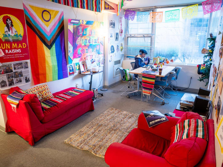 Latinx Student Center colorful room with student at desk